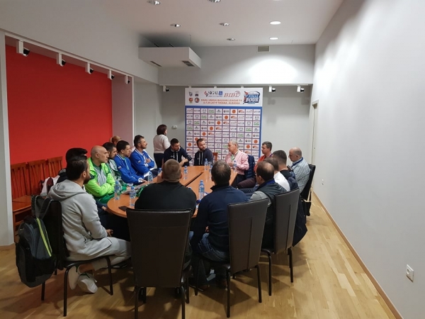 Coaches and referees meet before the Final Four